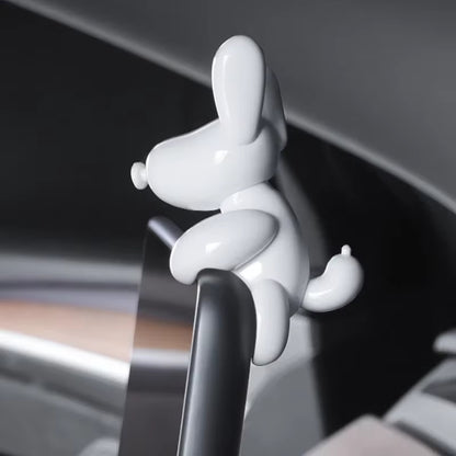 Car interior dog decoration adding character to Tesla Model 3 and Model Y screens without obstructing visibility