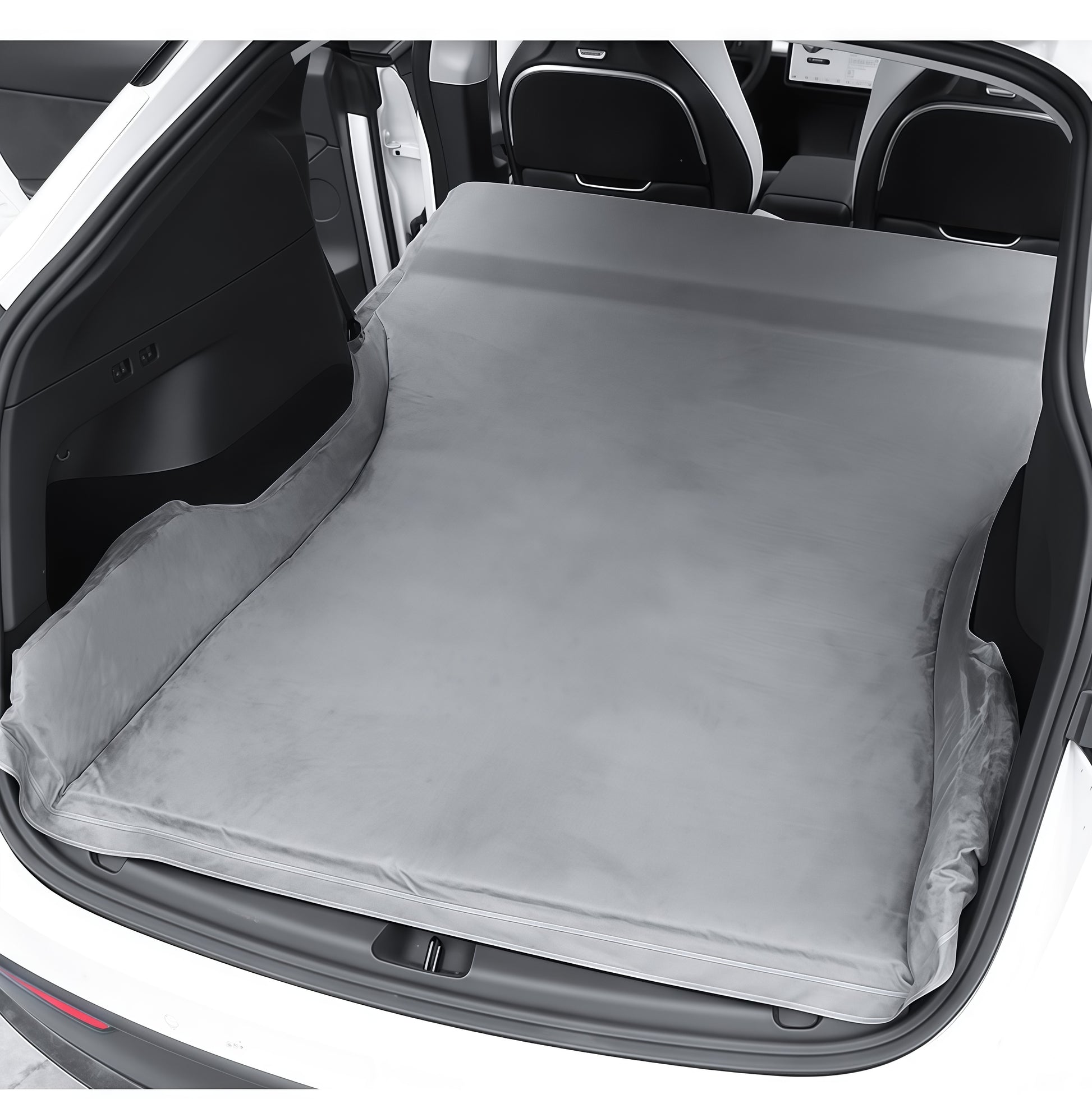 Soft suede camping mattress installed in Tesla Model Y trunk area, turning the vehicle into a comfortable car camping sleeping space
